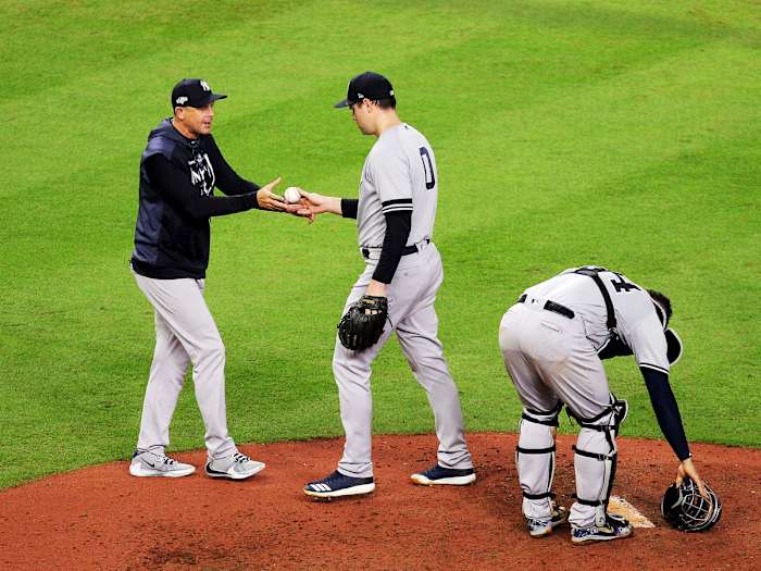 Oct 13, 2019; Houston, TX, USA; New York Yankees manager Aaron Boone (17) removes relief pitcher Adam Ottavino (0) during the fifth inning in game two of the 2019 ALCS playoff baseball series against the Houston Astros at Minute Maid Park. Mandatory Credit: Erik Williams-USA TODAY Sports